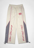 PROPERTY OF FIRST ROW TRACK PANTS